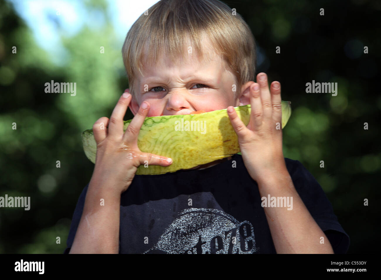 A boy eating a watermelon Stock Photo
