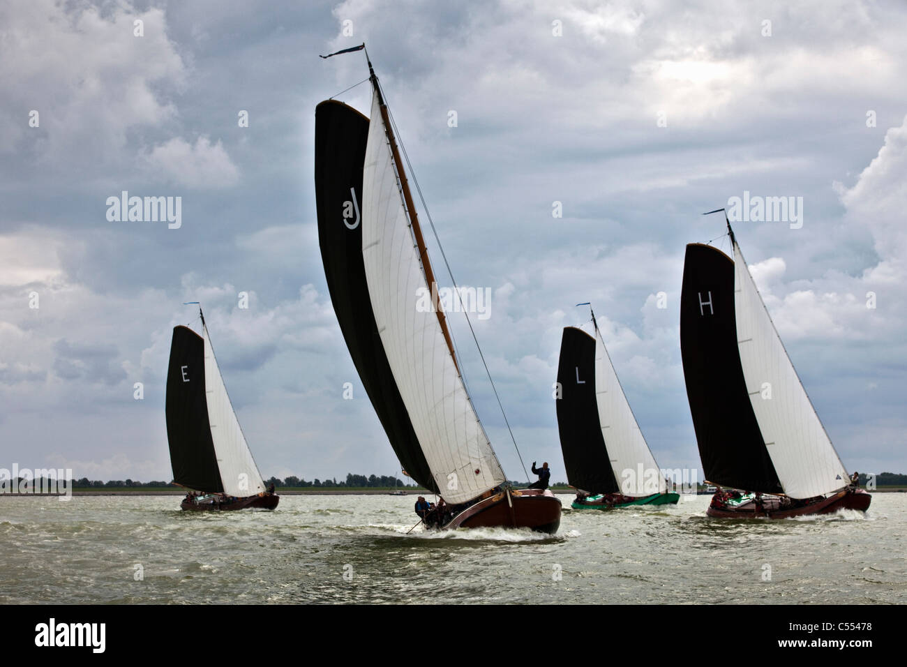 The Netherlands, Lemmer, Sailing races called Skutsjesilen, with traditional flat bottomed cargo boats called Skutsjes. Stock Photo