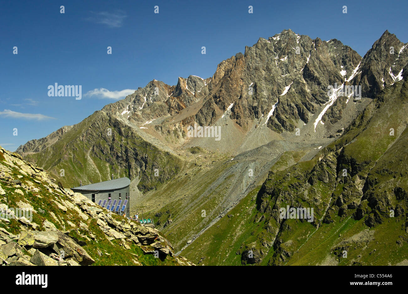 The Cabane du Velan of the Swiss Alpin Club (CAS) hidden in the Valsorey valley of the Pennine Alps, Valais, Switzerland Stock Photo