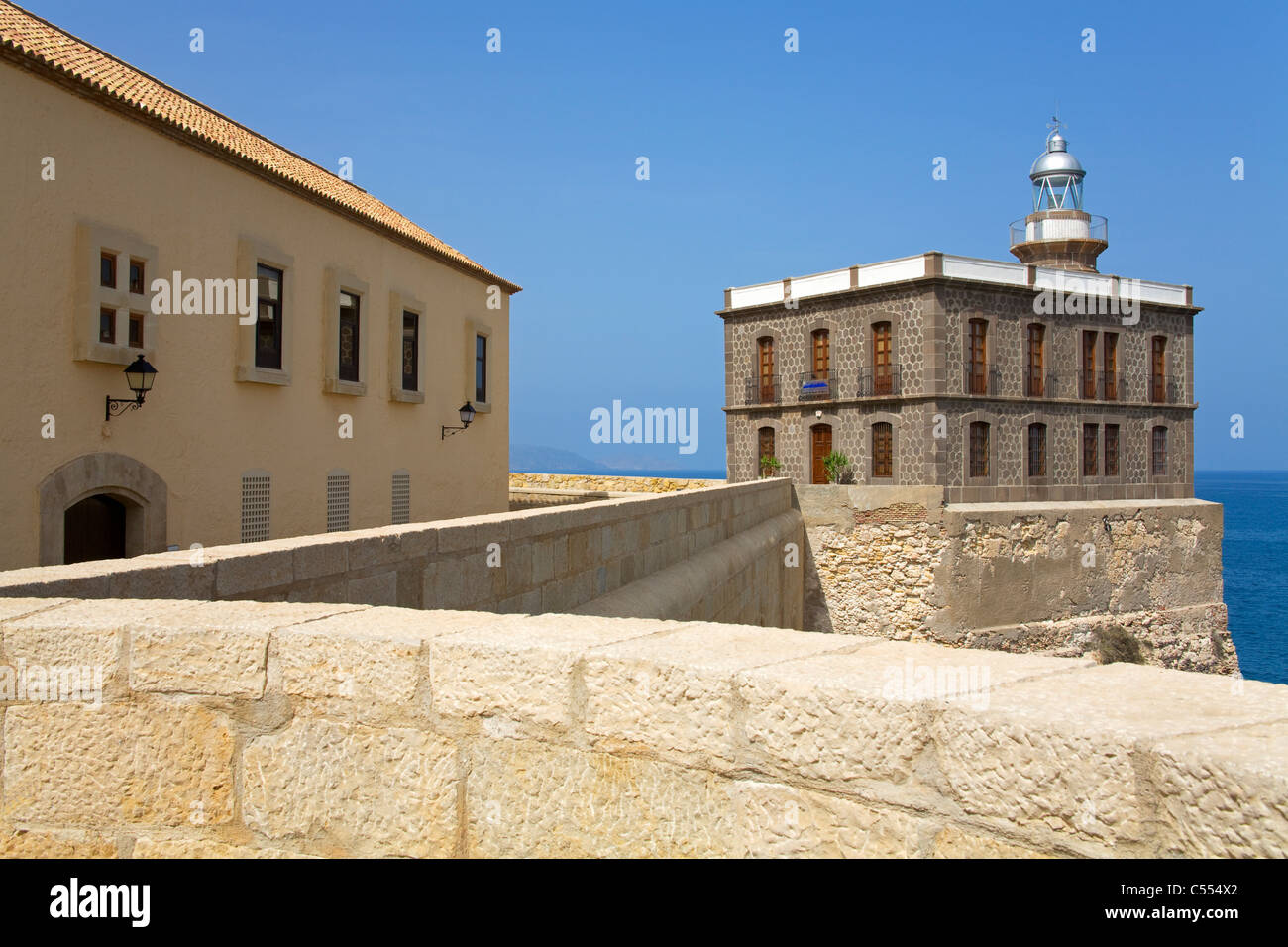 Lighthouse and hospital at waterfront, Hospital Del Rey, Melilla, Spain Stock Photo