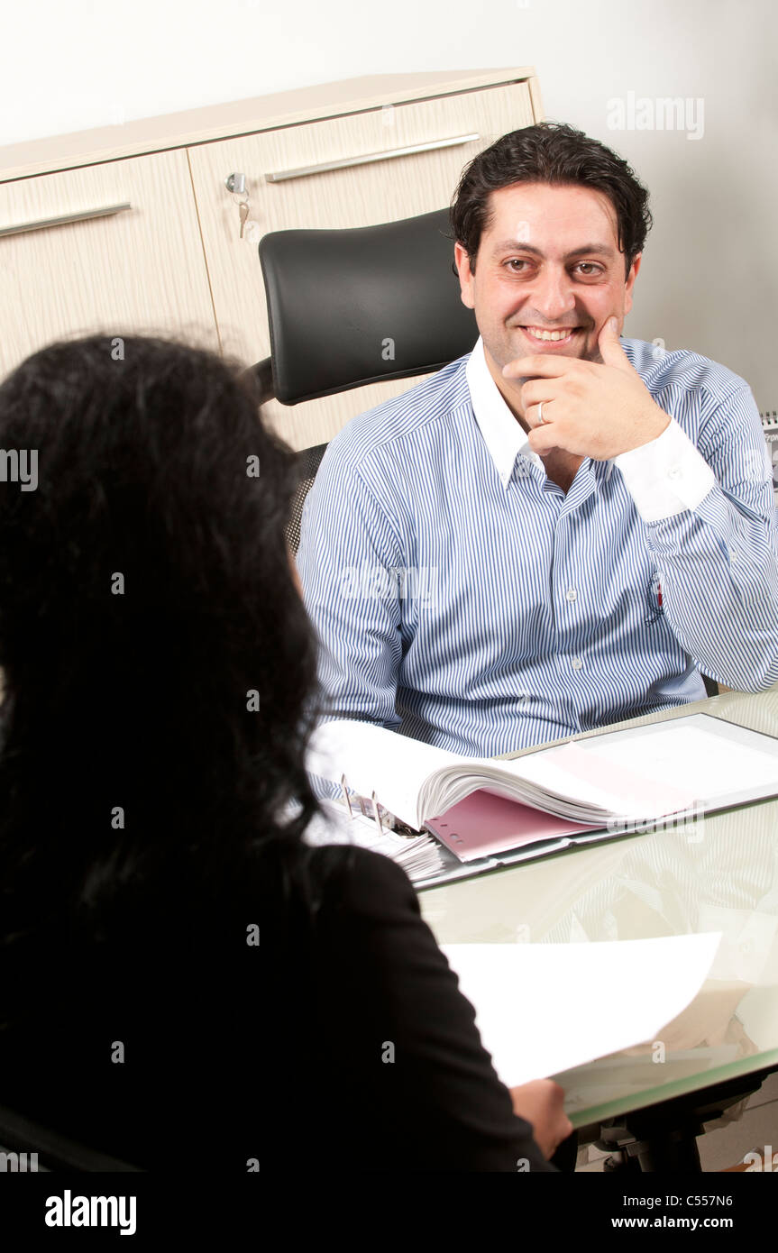Happy business man and woman inside office Stock Photo - Alamy