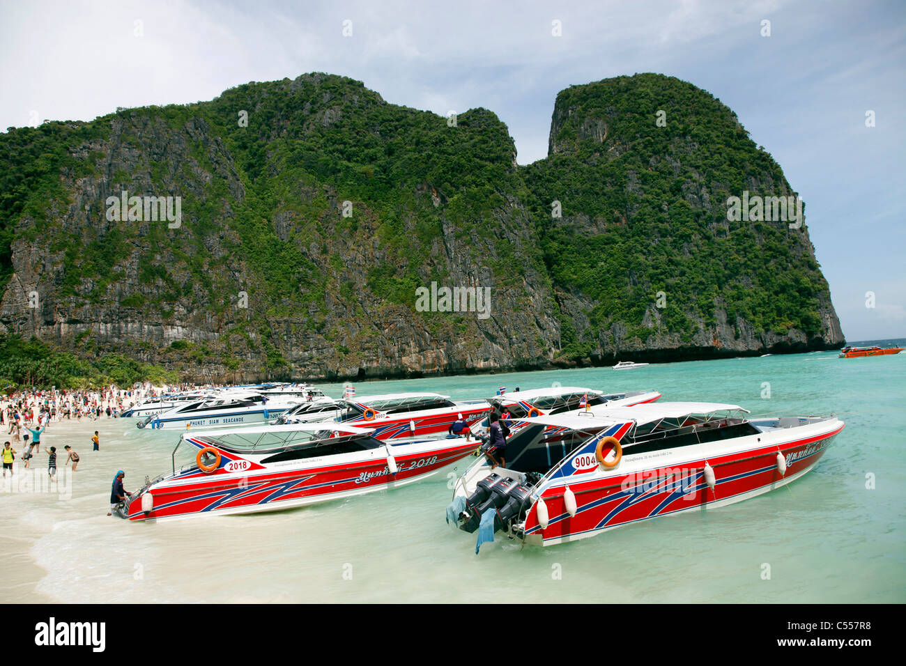 Boats and speedboats in Maya Bay where The Beach was filmed, Ko Phi Phi Ley, Phuket, Thailand Stock Photo