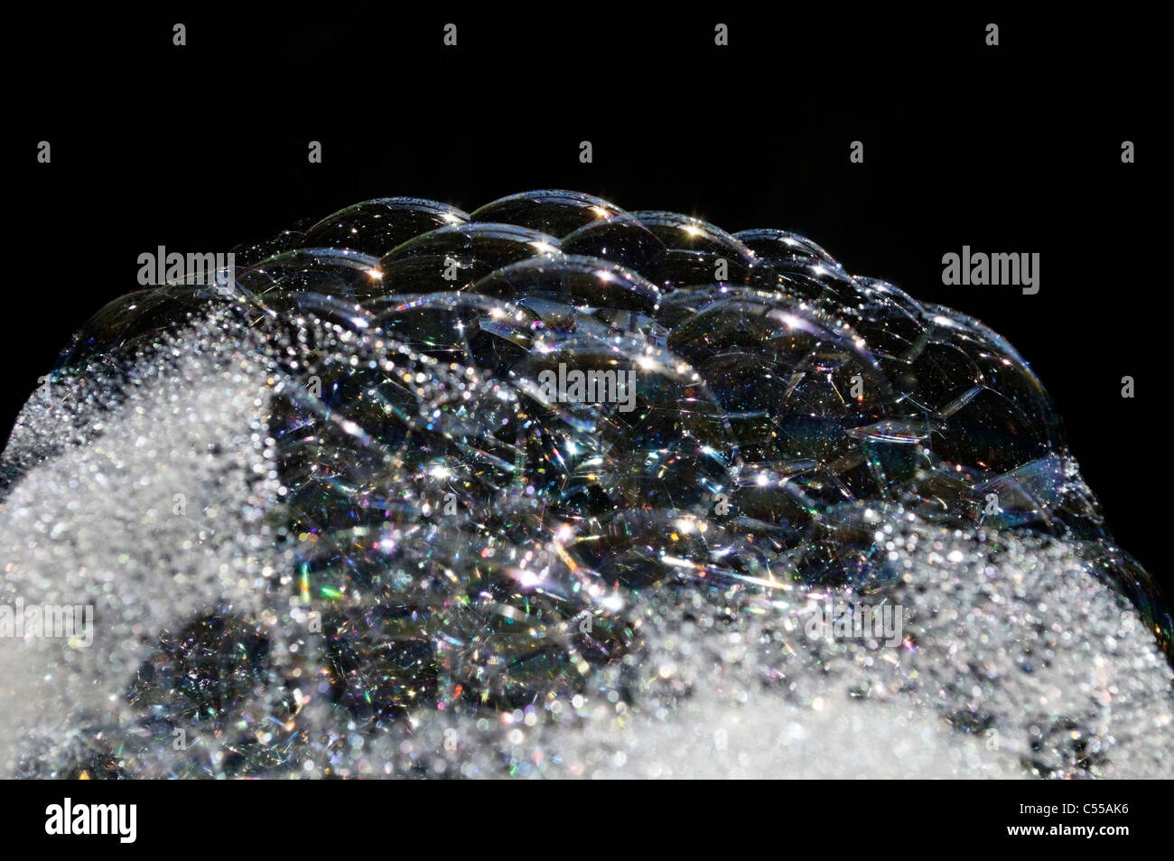 Soap bubbles against black background Stock Photo - Alamy
