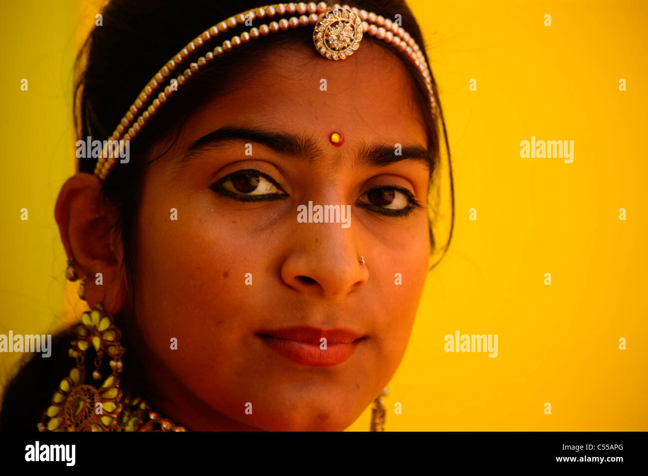 A girl wearing traditional ornaments hires stock photography and