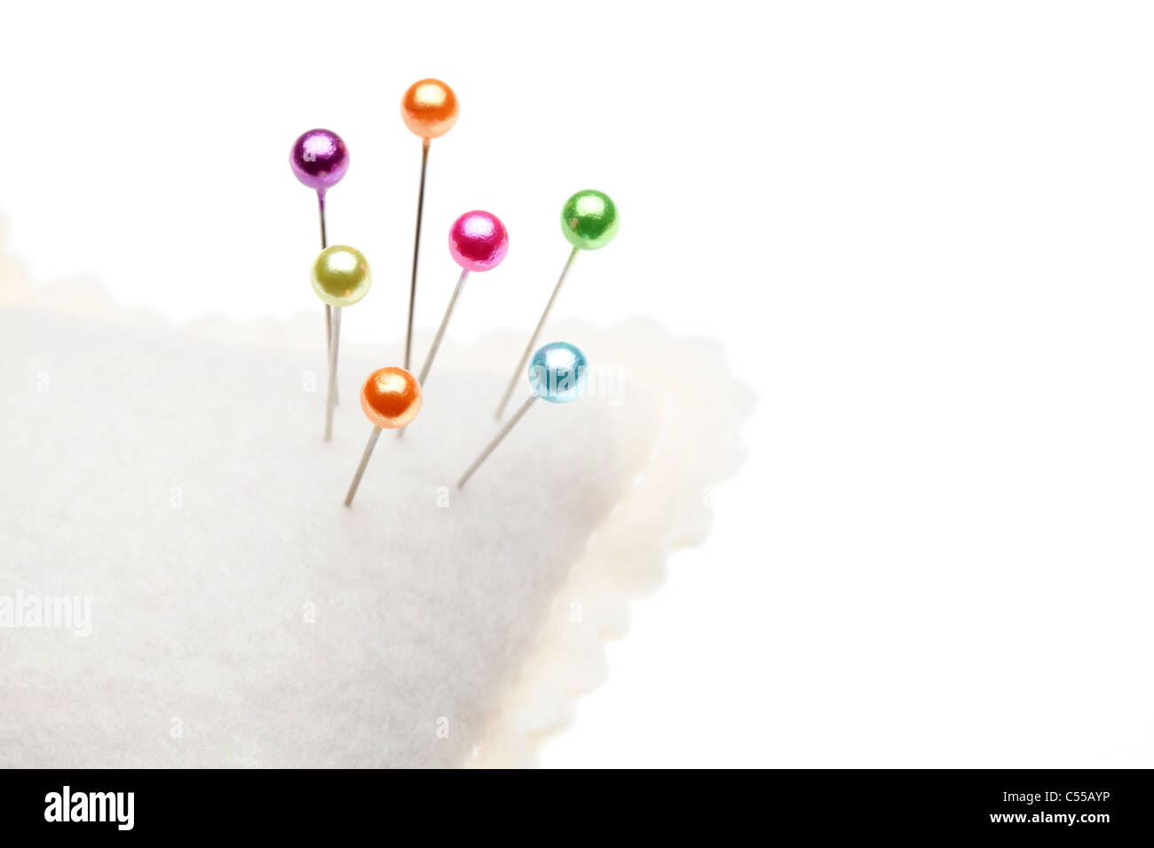 Sewing pins and pin cushion on a white Stock Photo Alamy