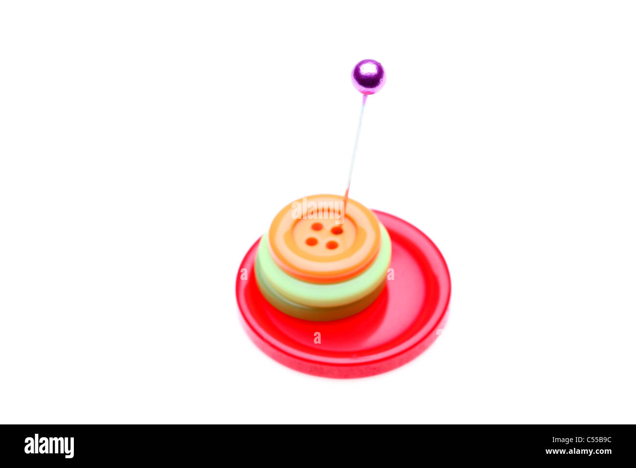 Buttons and color pin isolated on white background Stock Photo