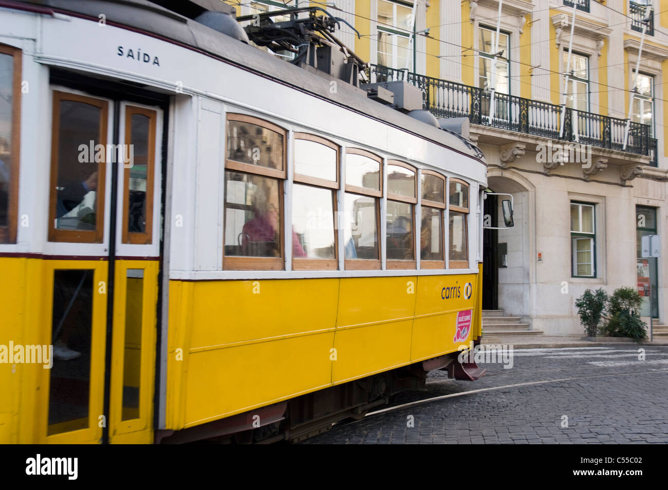 Yellow tram on the street, Lisbon, Portugal Stock Photo