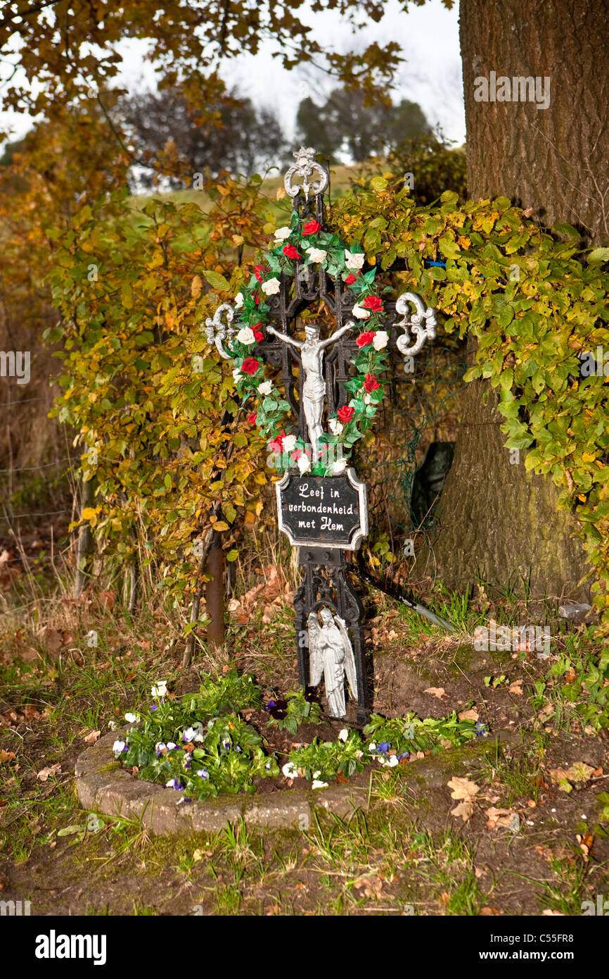 The Netherlands, Epen, Cross with image of Jesus Christ along road. Stock Photo