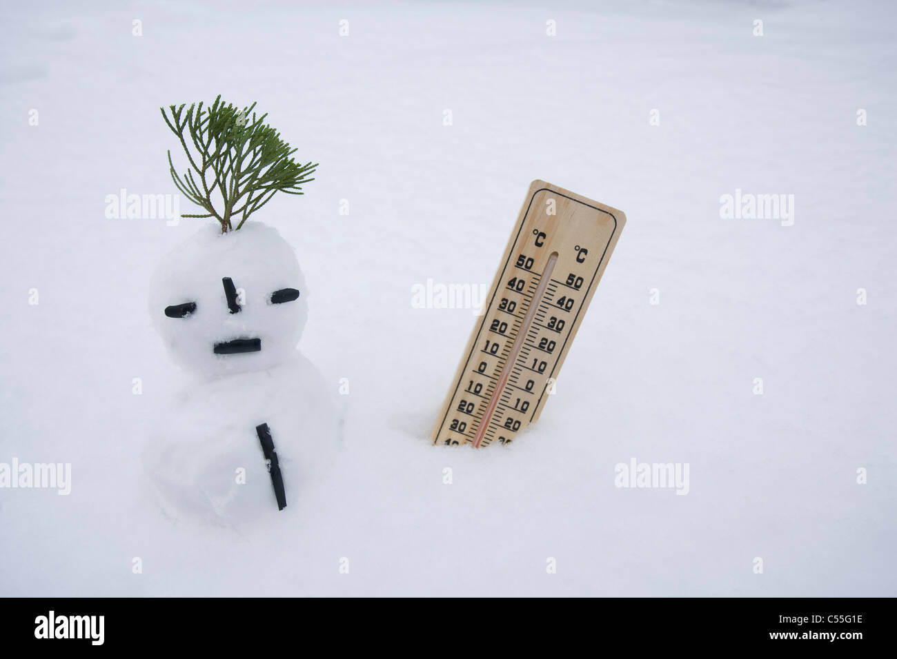 snowman and temperature on snow field Stock Photo - Alamy