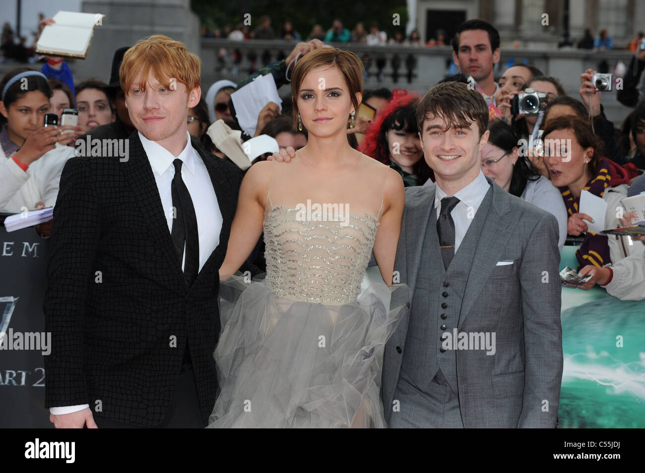 RUPERT GRINT EMMA WATSON & DANIEL RADCLIFFE HARRY POTTER AND THE DEATHLY HALLOWS - PART 2 - WORLD PREMIERE TRAFALGAR SQUARE LO Stock Photo