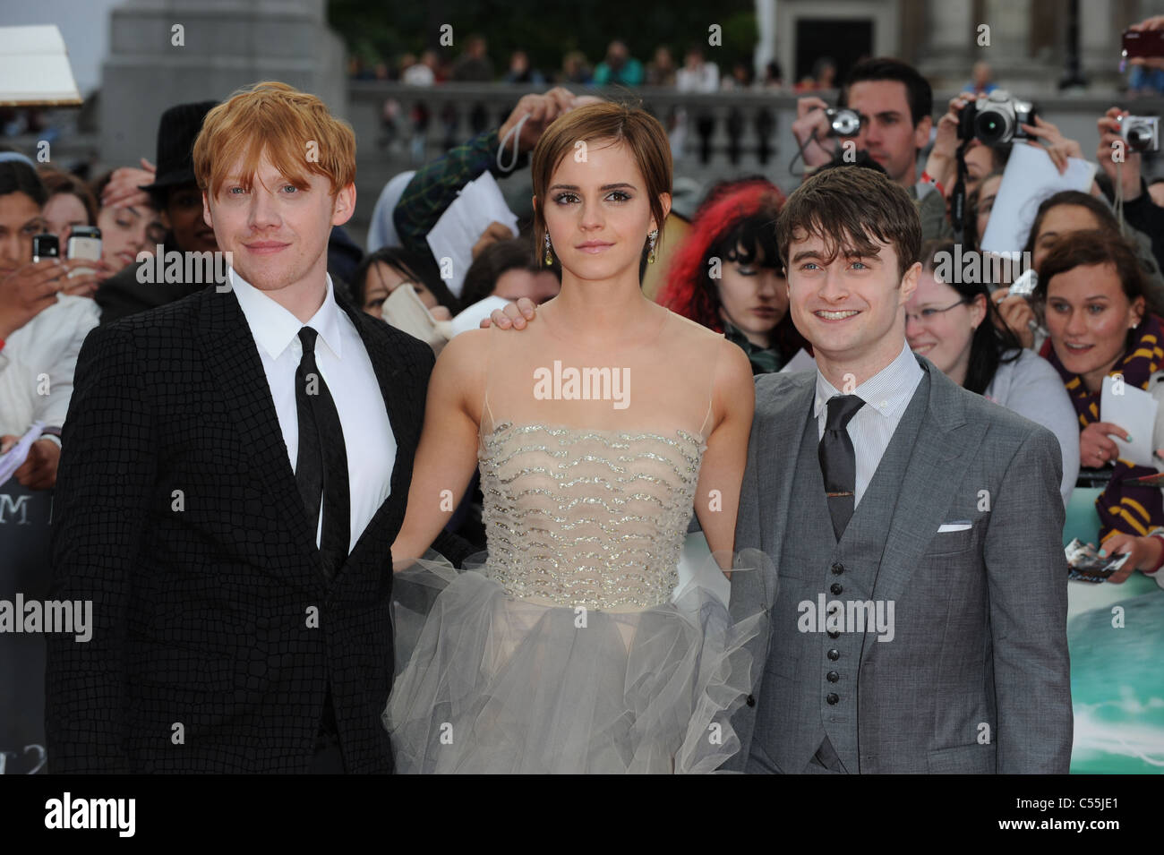 RUPERT GRINT EMMA WATSON & DANIEL RADCLIFFE HARRY POTTER AND THE DEATHLY HALLOWS - PART 2 - WORLD PREMIERE TRAFALGAR SQUARE LO Stock Photo