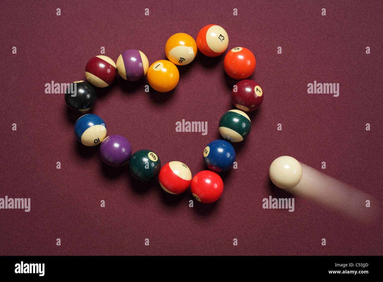 Breaking heart concept using billiard balls Stock Photo