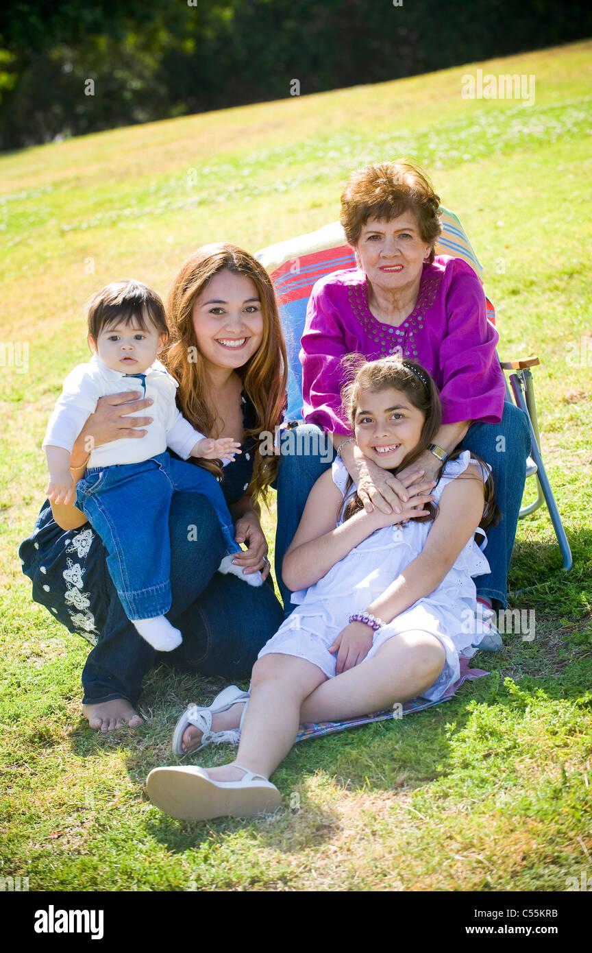 Portrait of a happy family in the park Stock Photo - Alamy