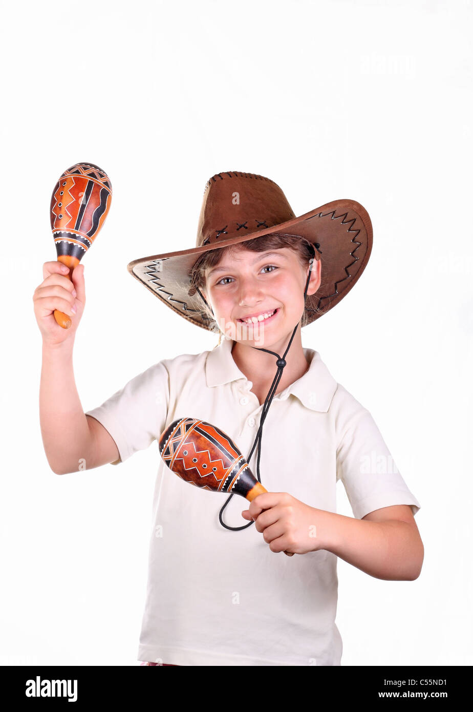 The girl in a brown Mexican hat with maracas on a white background Stock Photo