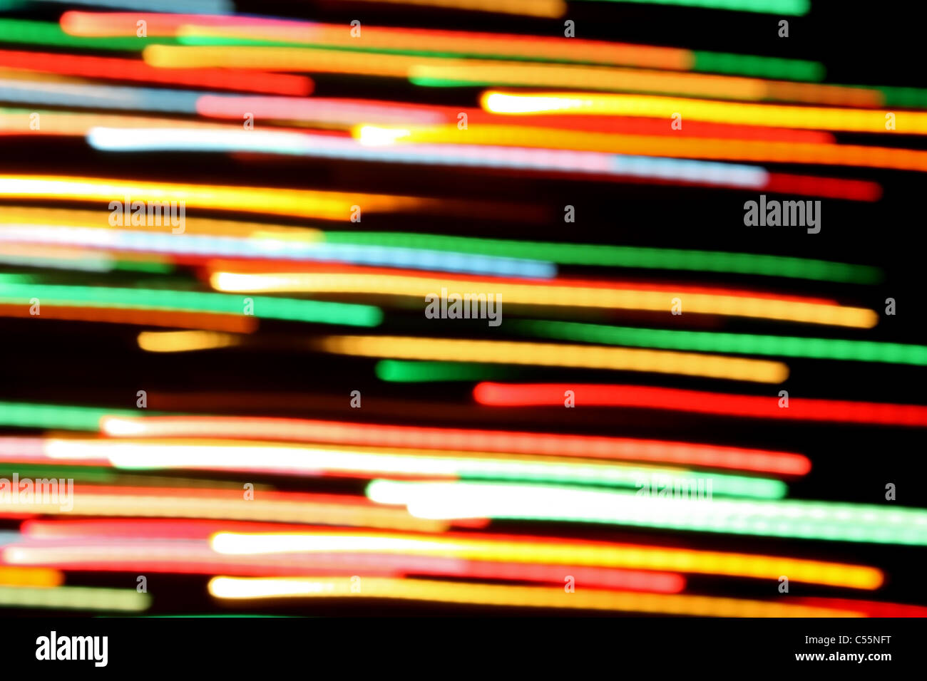 Multicolored streaks of light against a black background Stock Photo ...
