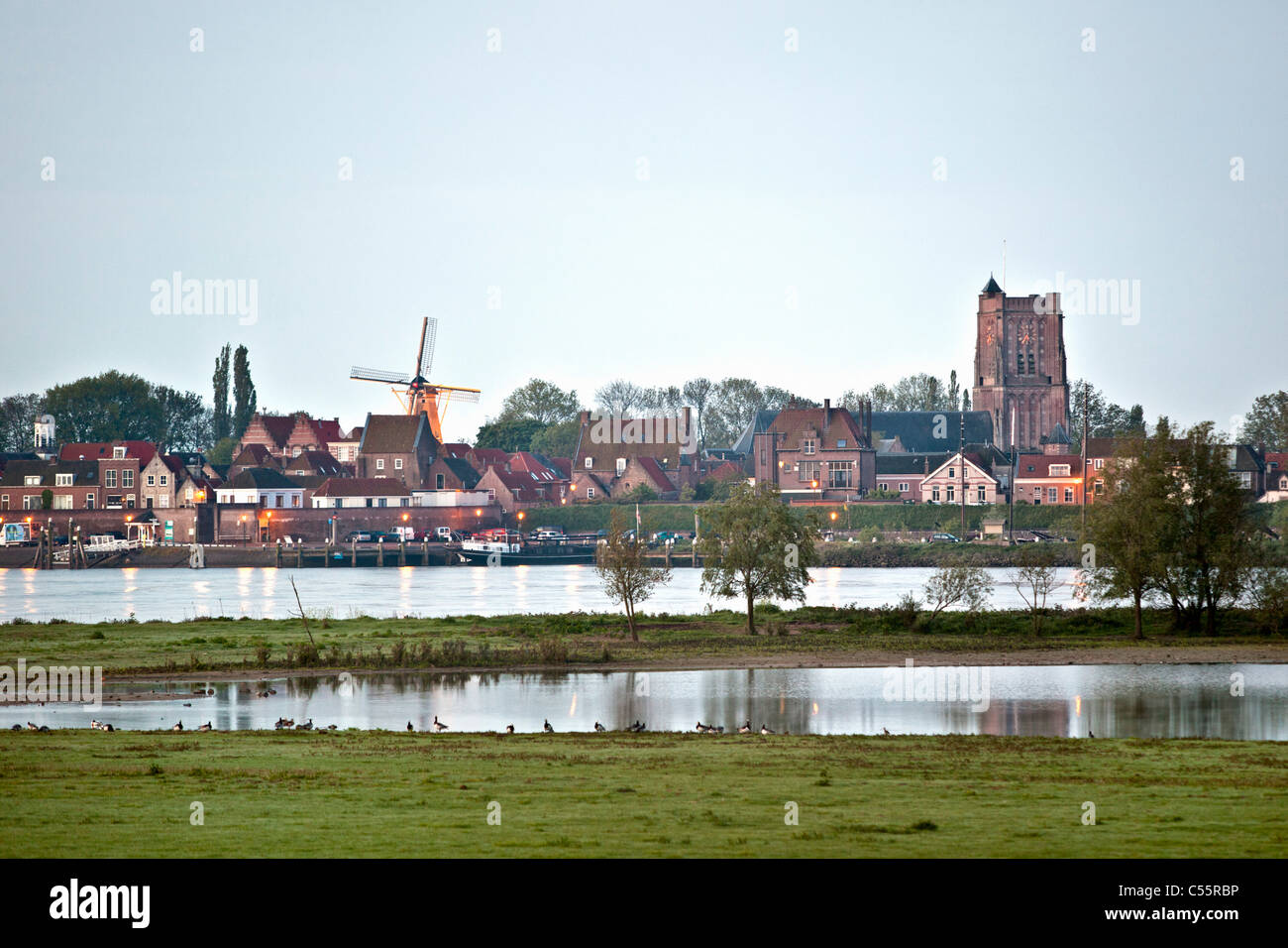 The Netherlands, Woudrichem, Skyline at dawn. River called Maas. Stock Photo
