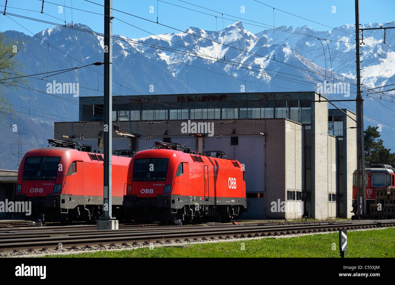 Two Austrian OeBB locomotives at the Swiss train station of Buchs SG, Switzerland CH Stock Photo