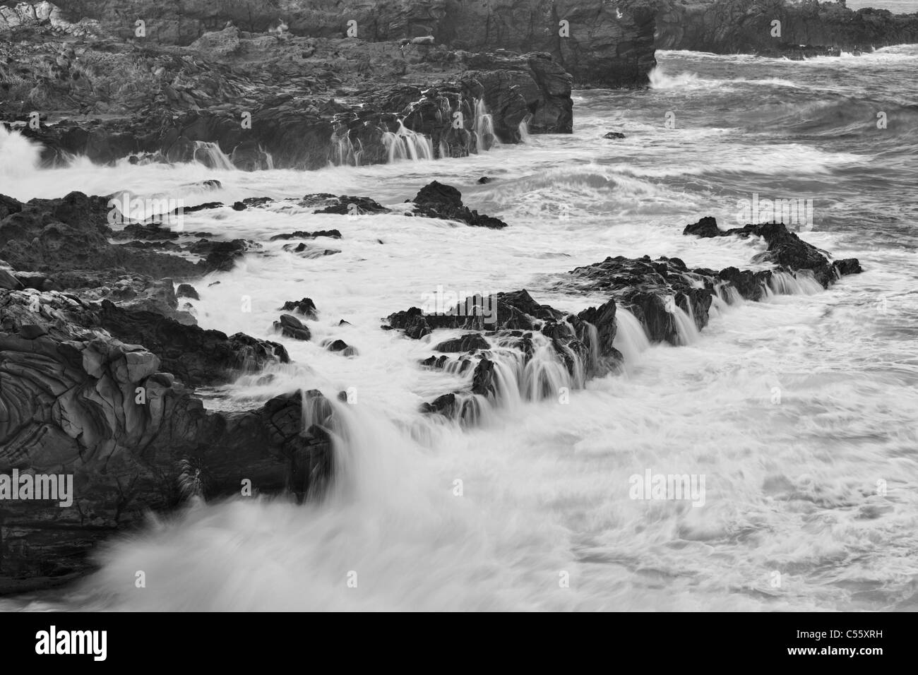 Waves breaking on rocks, Oneloa Bay Beach, Maui, Hawaii, USA Stock Photo