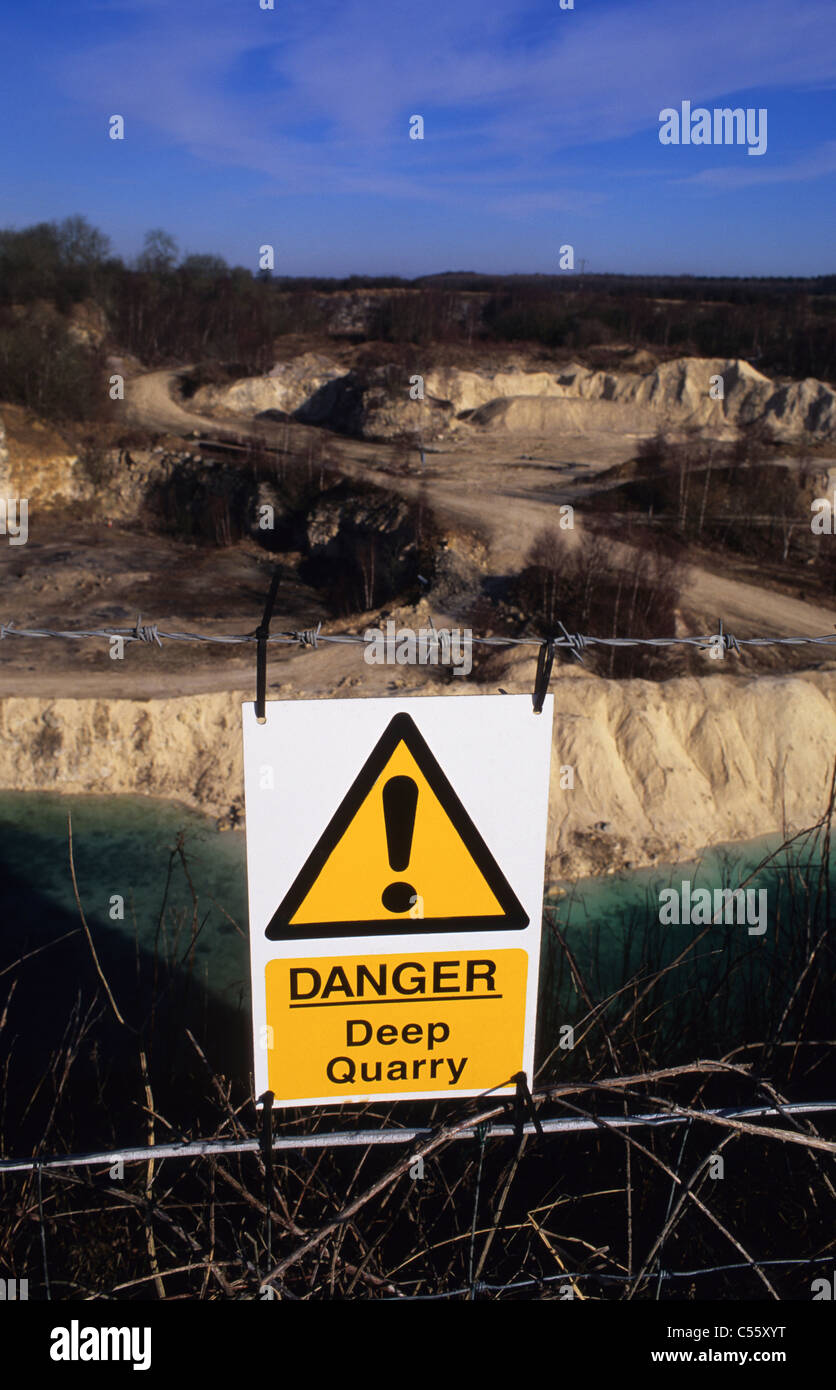 danger deep quarry warning sign at limestone quarry Yorkshire UK Stock