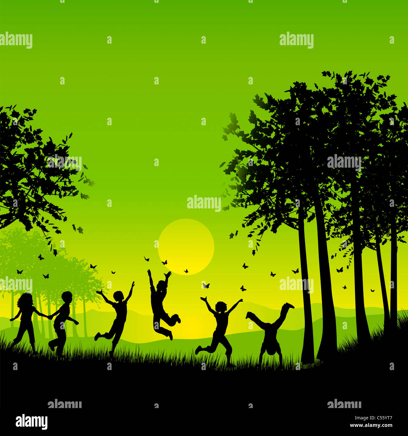 Silhouettes of children playing outside chasing butterflies Stock Photo