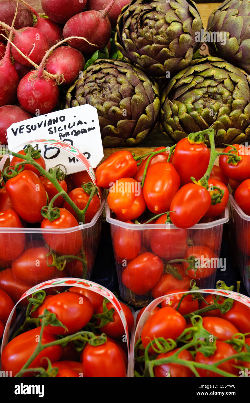 Tomatoes and artichokes on display at a street market. Bolzano, Italy. mediterranean food cuisine. Stock Photo