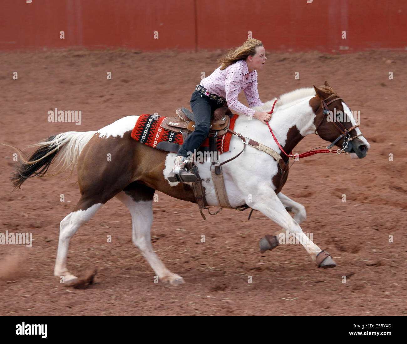 Woman competing in the barrel racing event at the Annual Indian Rodeo ...