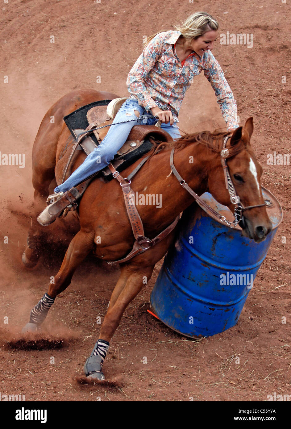 Woman competing in the barrel racing event at the Annual Indian Rodeo