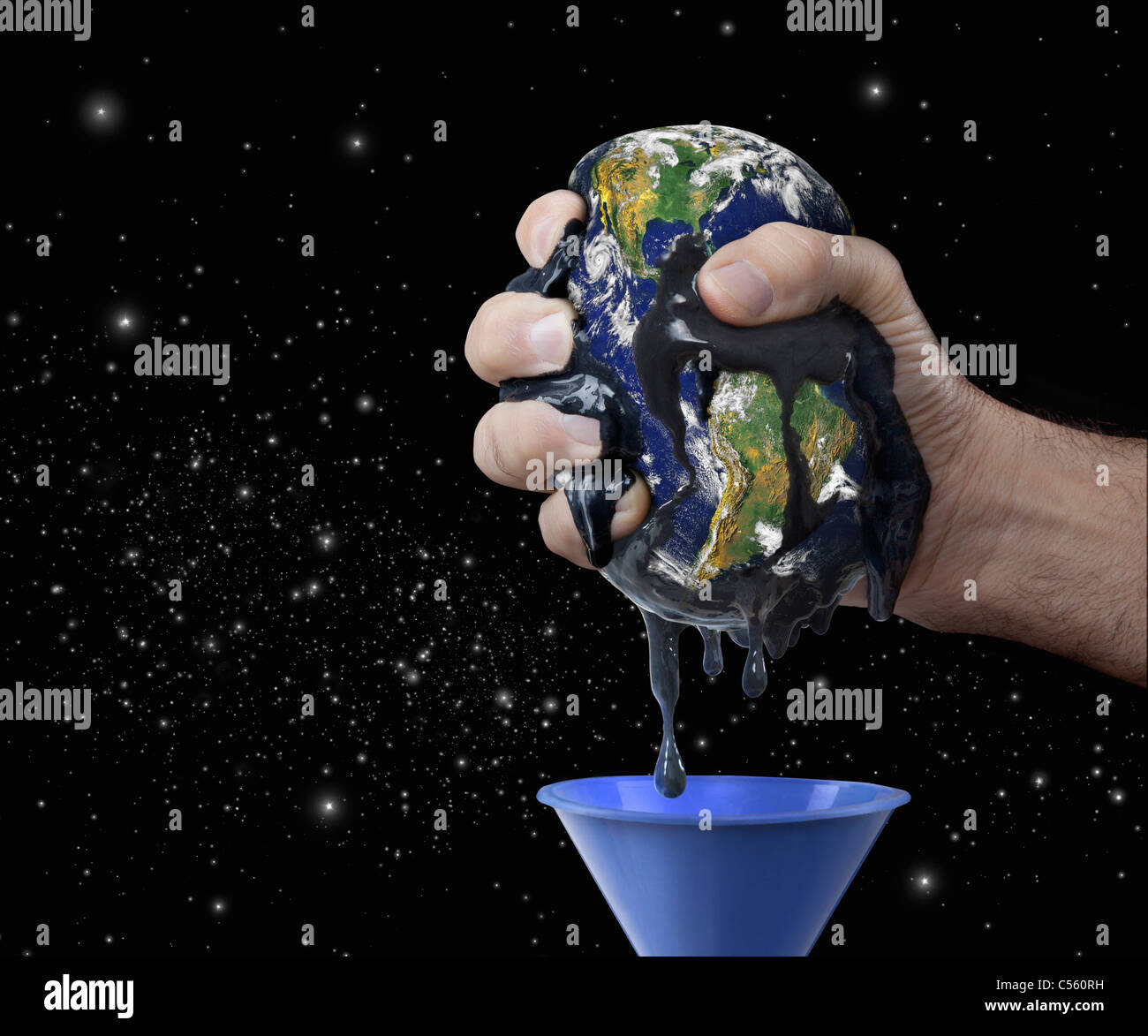 The Earth being squeezed by man's hand to extract oil from it