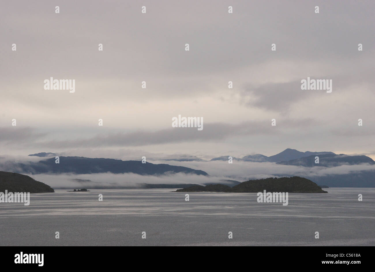 Clouds over mountain range, Darwin Channel, Patagonia, Chile Stock