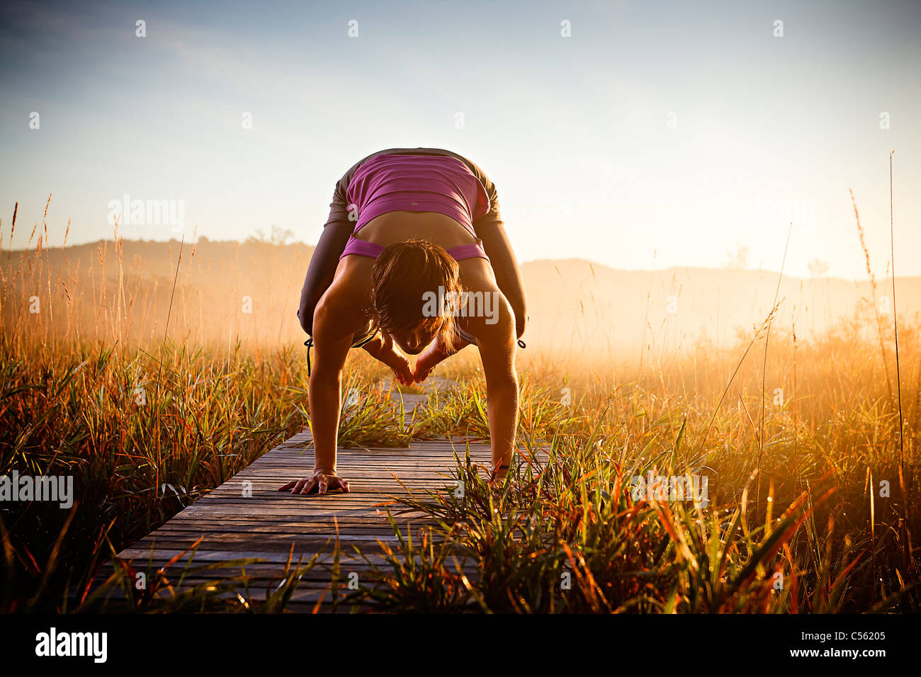 Woman in landscape bending body hires stock photography and images Alamy