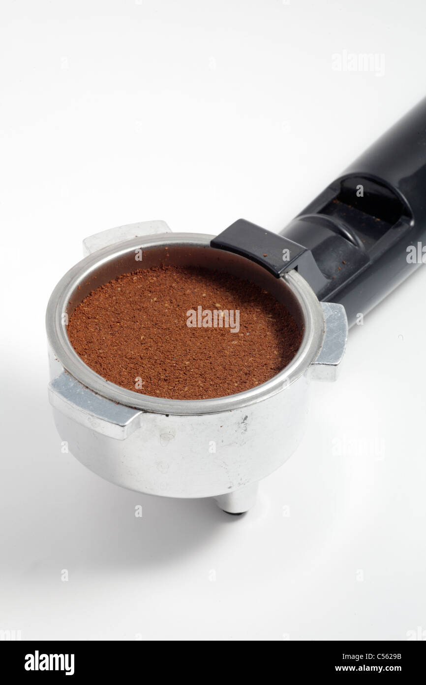 Portafiltro or portafilter of home espresso expresso maker with freshly ground coffee closeup detail Stock Photo - Alamy