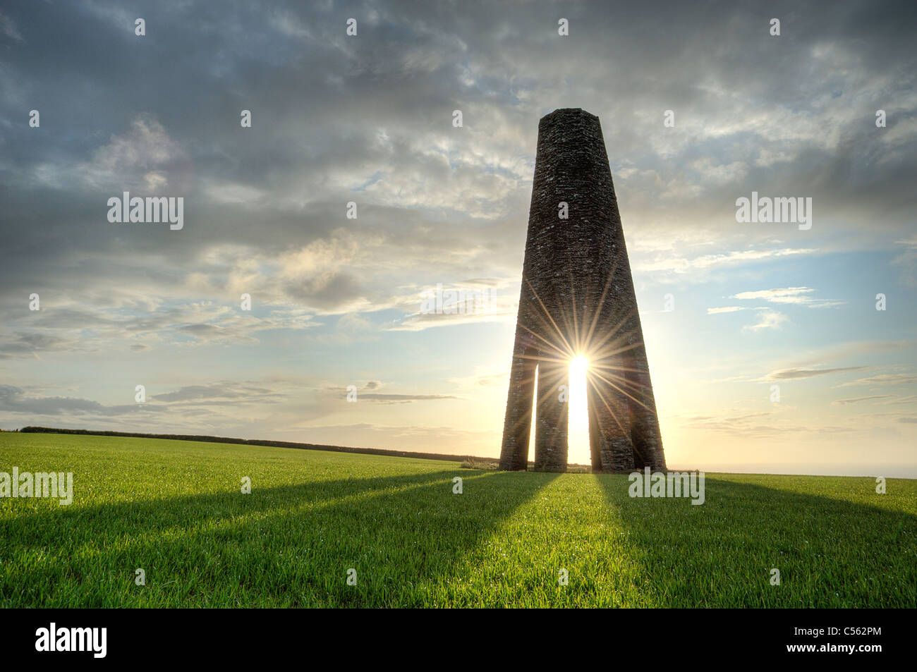 A summer sunrise through the Daymark navigation tower near Kingswear, South Devon. Stock Photo