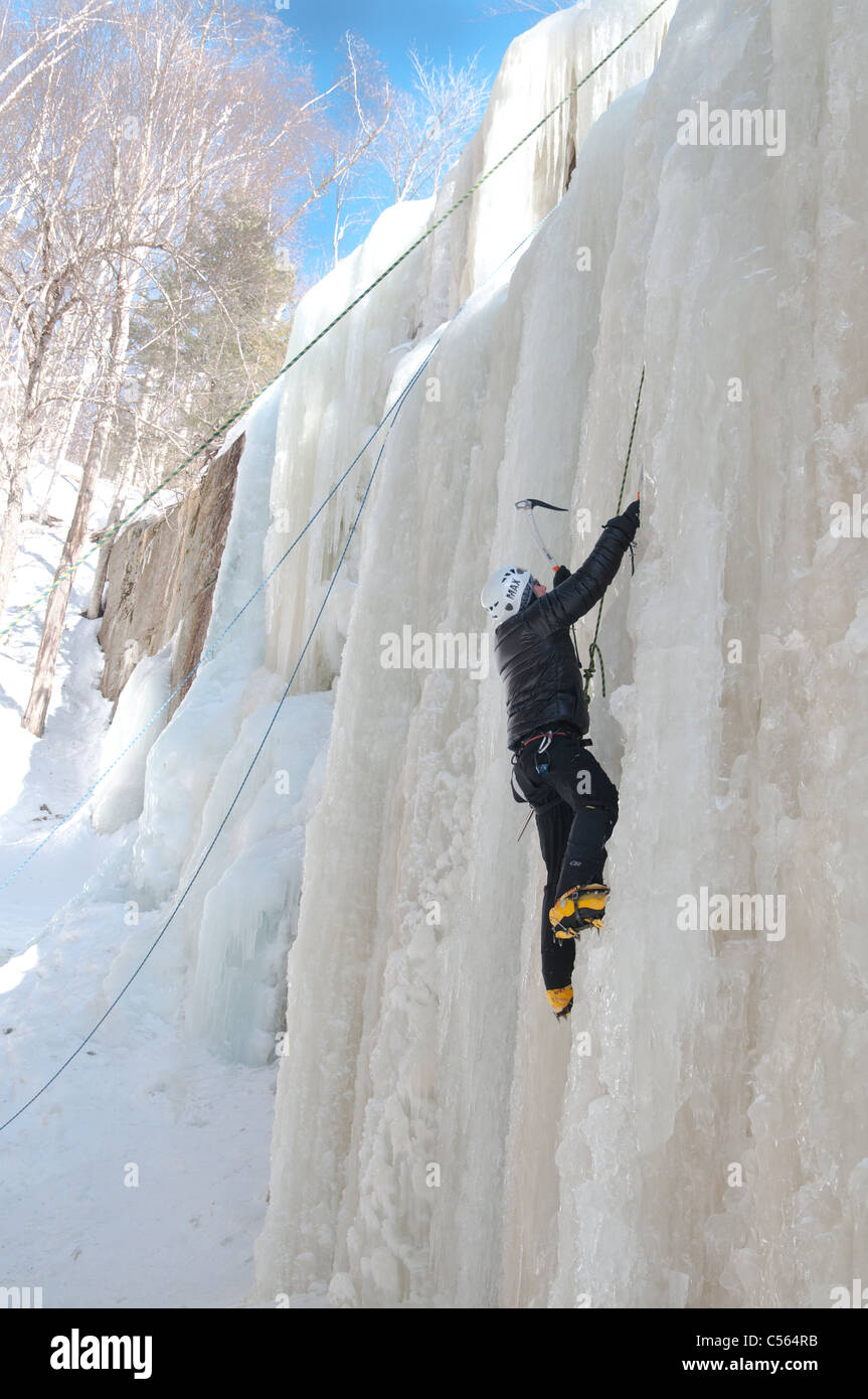 Male ice climber on Champney Falls in the White Mountain National