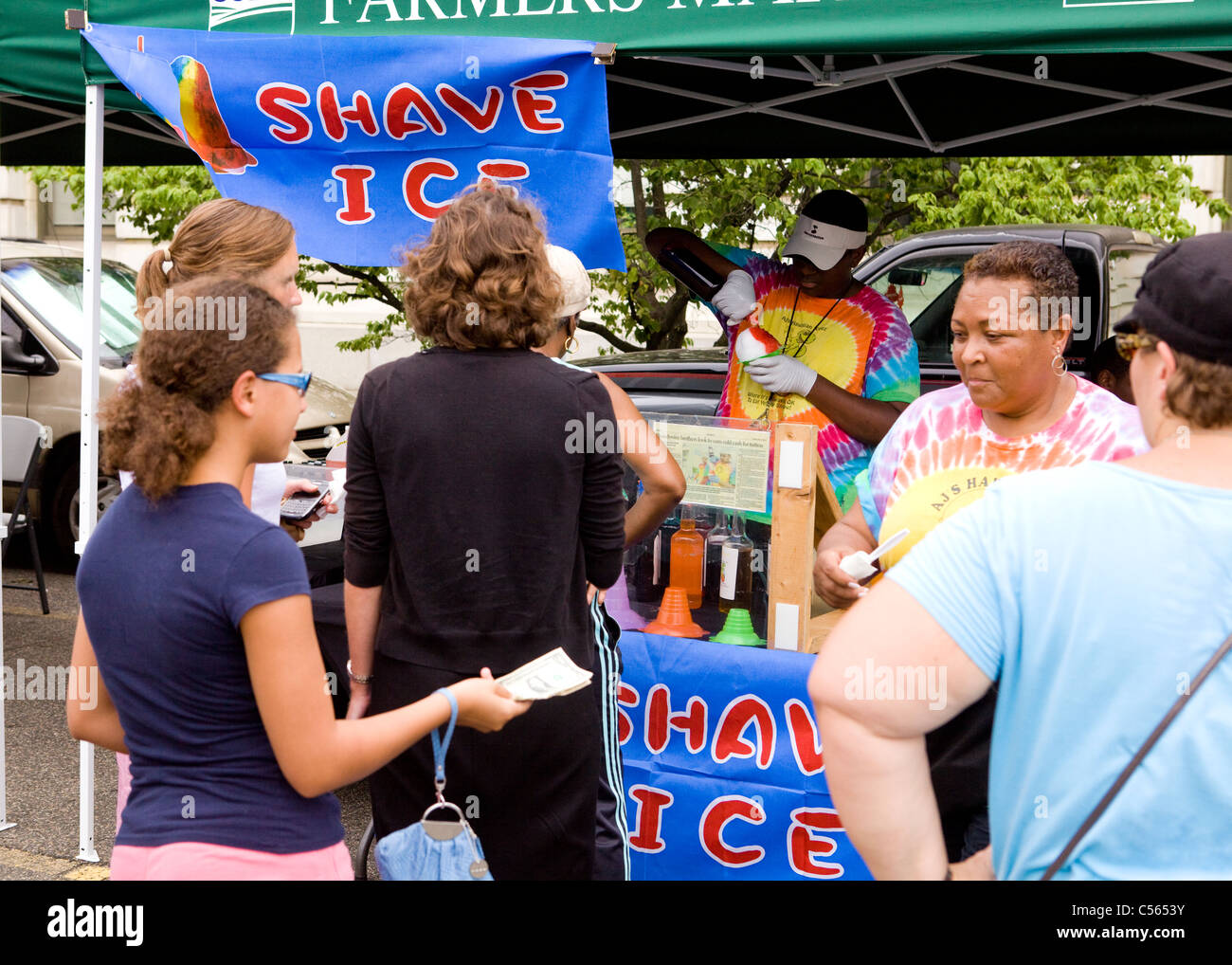 People standing in queue for shaved ice cones Stock Photo