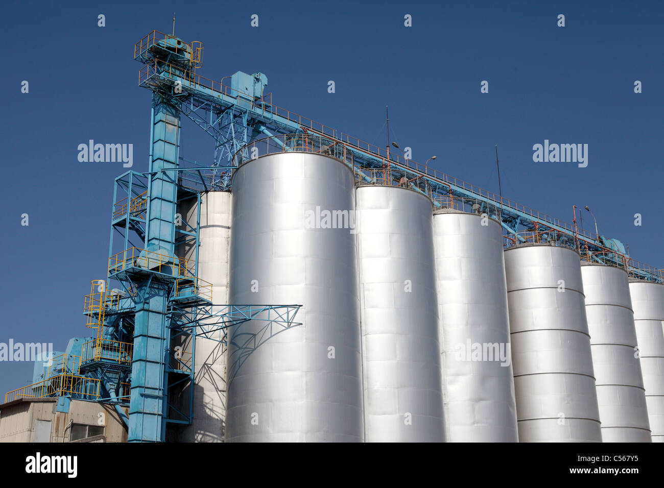 Industrial silo against the blue sky Stock Photo - Alamy