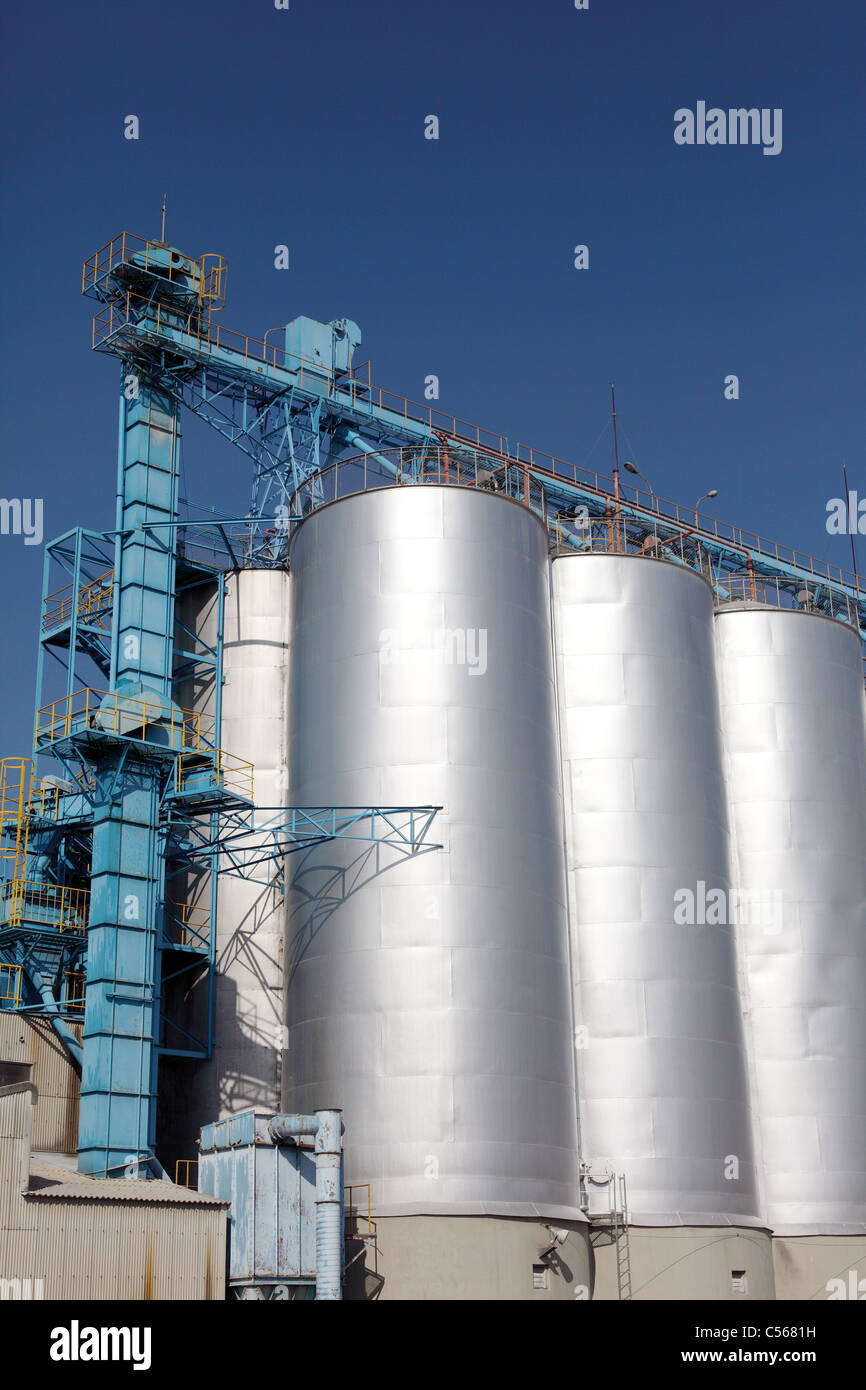 Industrial silo against the blue sky Stock Photo - Alamy