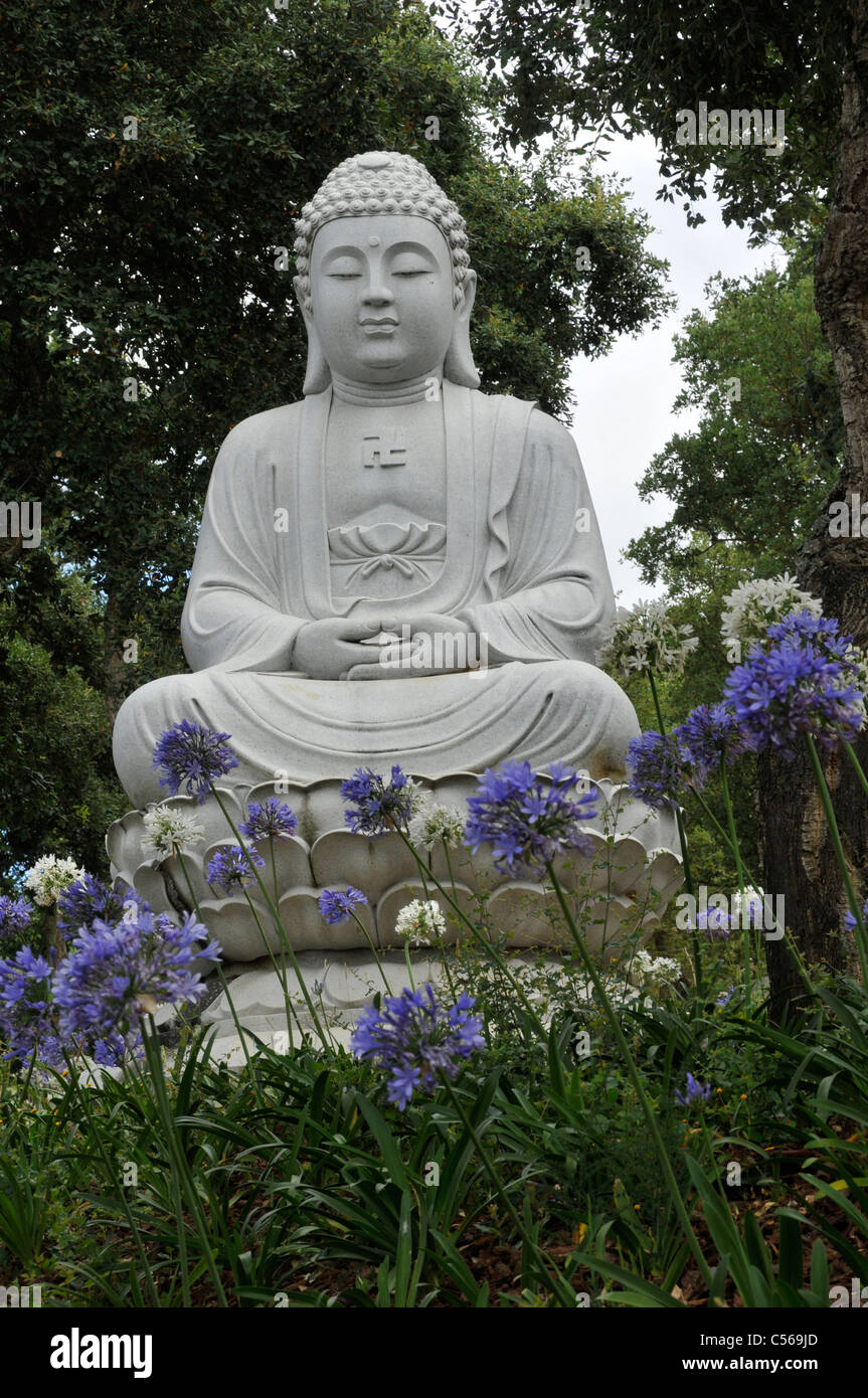 White stone statue of a god, Buddha Eden Garden or Garden of Peace
