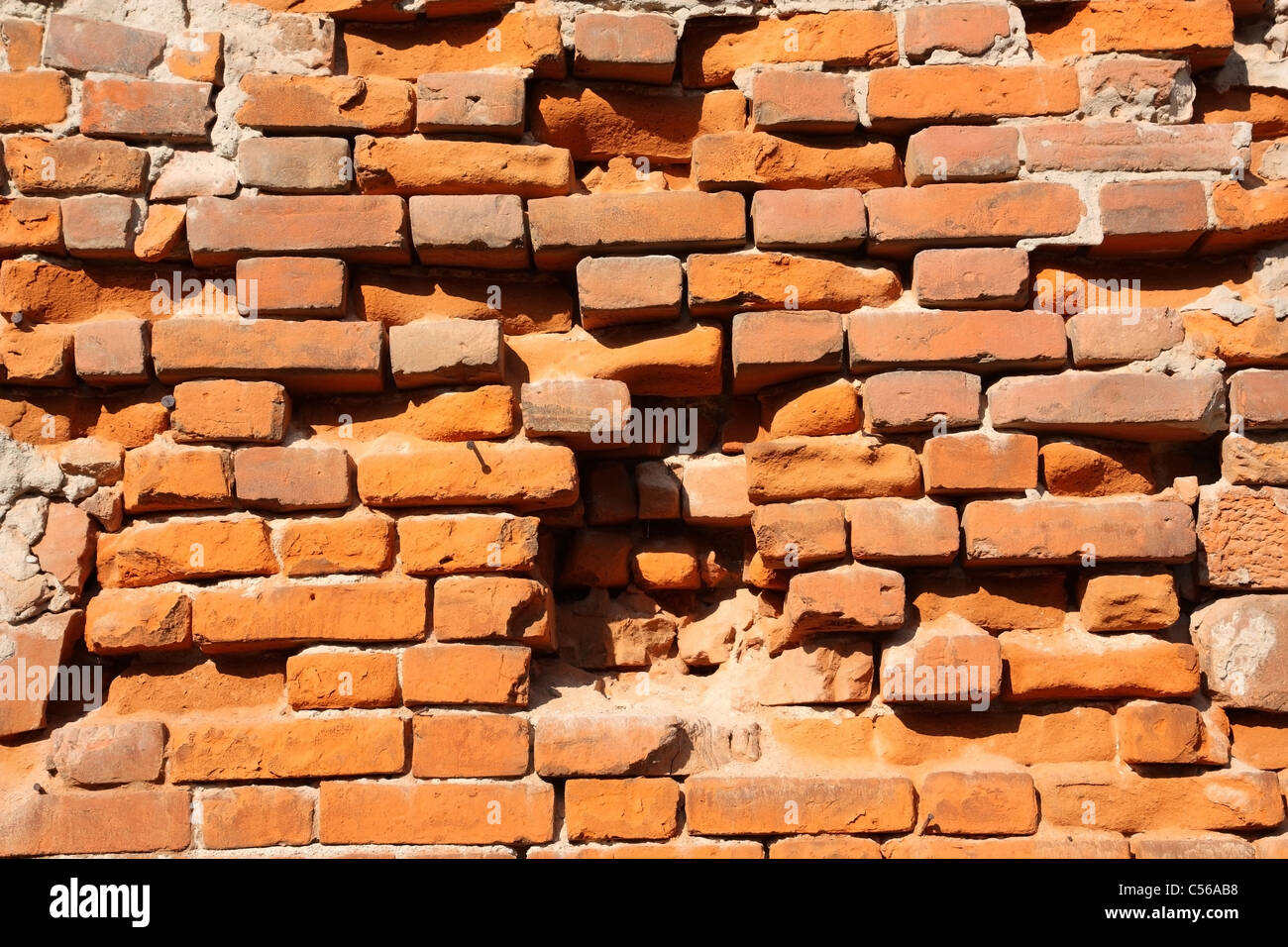 It depicts an old brick wall crumbling Stock Photo Alamy