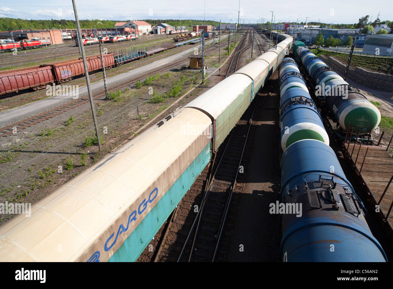 Very long cargo train and tanker cars at Oulu railroad yard , Finland Stock Photo