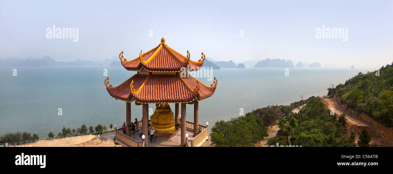 Halong bay landscape, Buddhist temple pagoda in foreground, hazy islets in background. North Vietnam Stock Photo