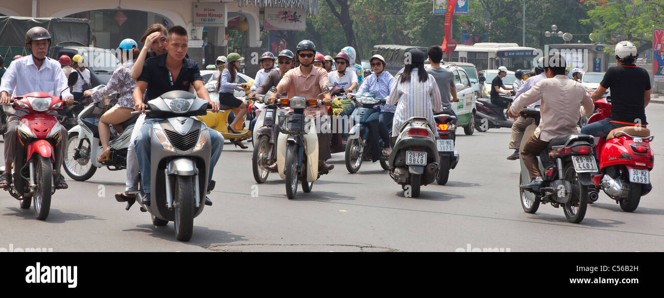 Hanoi Vietnam busy traffic, bus motor cycles Stock Photo