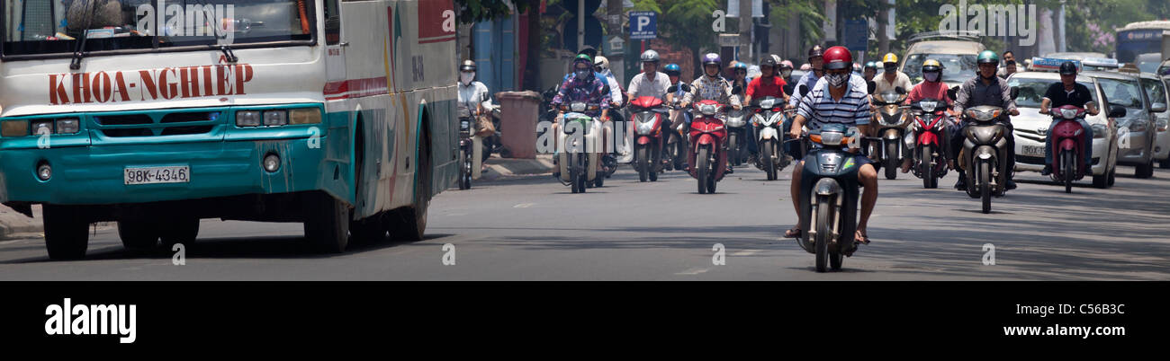 Hanoi Vietnam busy traffic, bus motor cycles Stock Photo