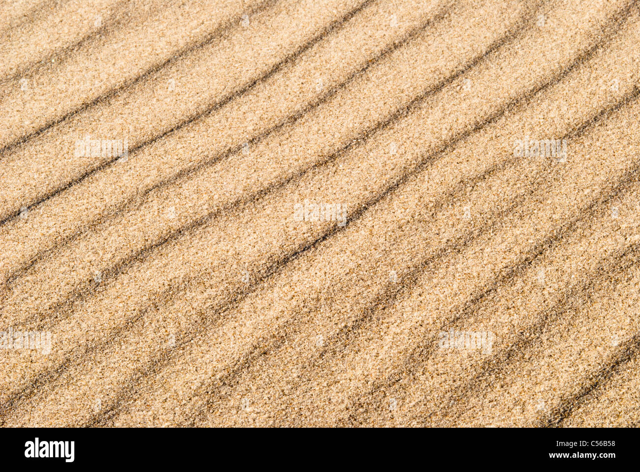yellow sand with wave drawing as a texture or background Stock Photo