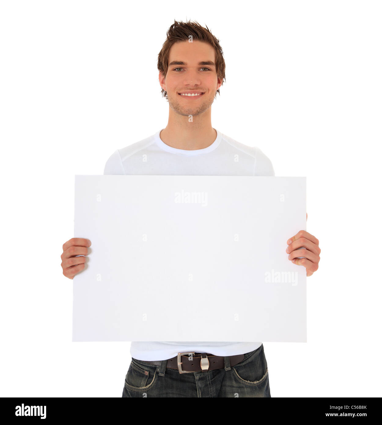 Attractive young man holding blank sign. All on white background. Stock Photo