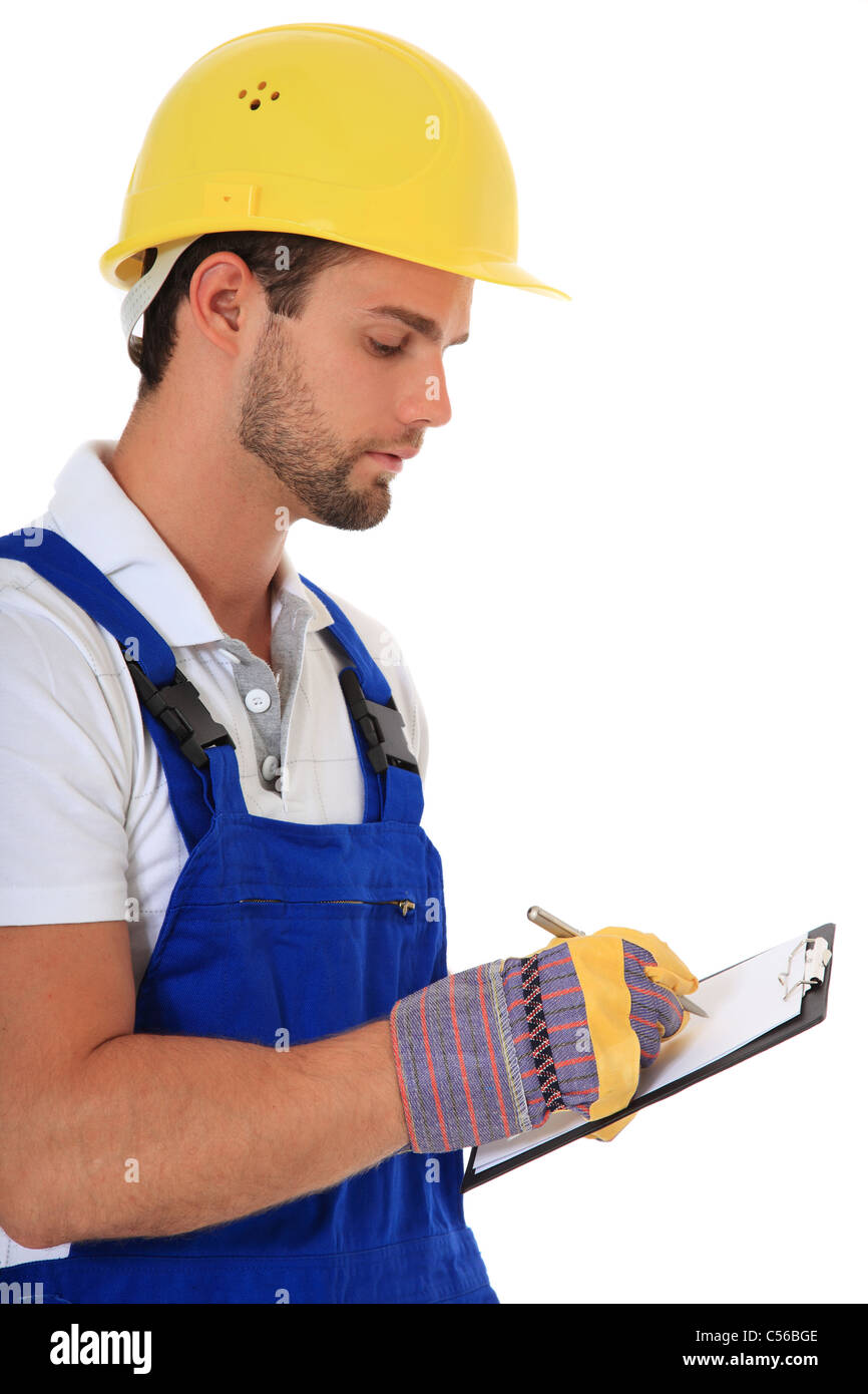 Manual worker writing on clipboard. All on white background. Stock Photo