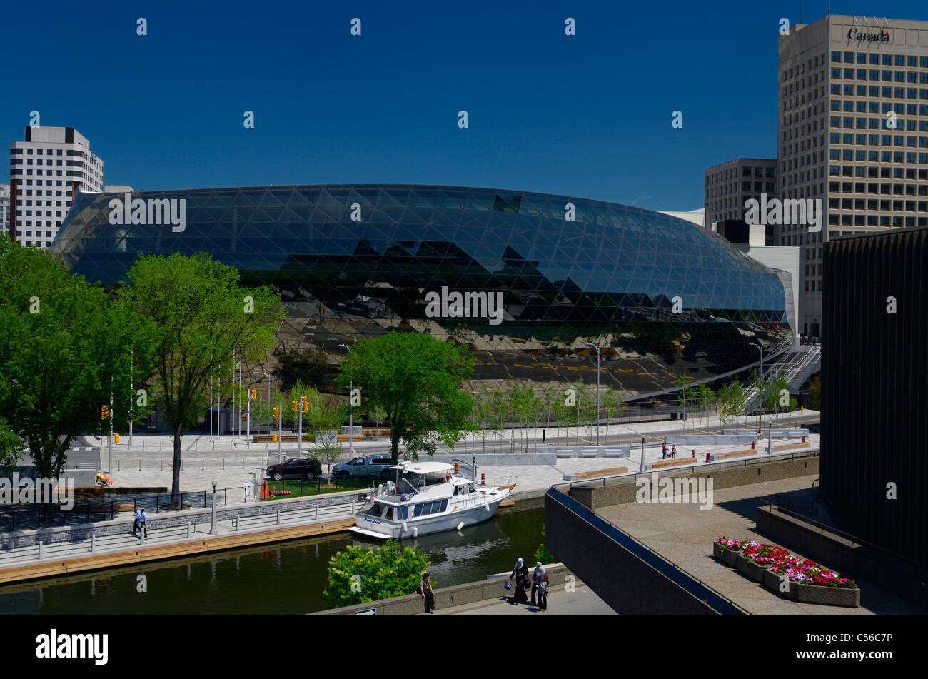 View of the new glass Ottawa Convention Centre on the Rideau Canal from the National Arts Centre Canada Stock Photo