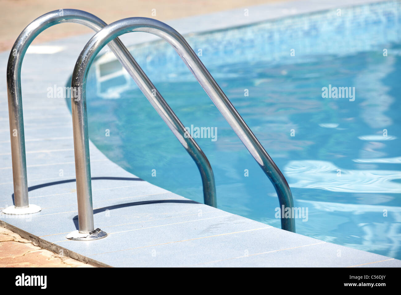 Handrail of the public swimming pool. Horizontal photo Stock Photo - Alamy