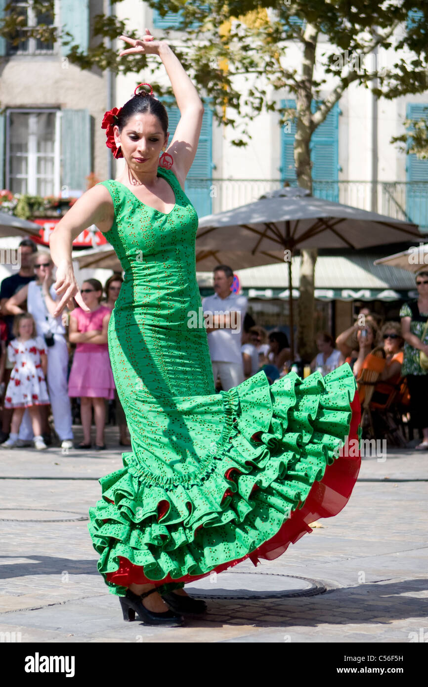 Spanish dancer in green and red dress with black shoes dancing in Carcassonne 11000 Stock Photo
