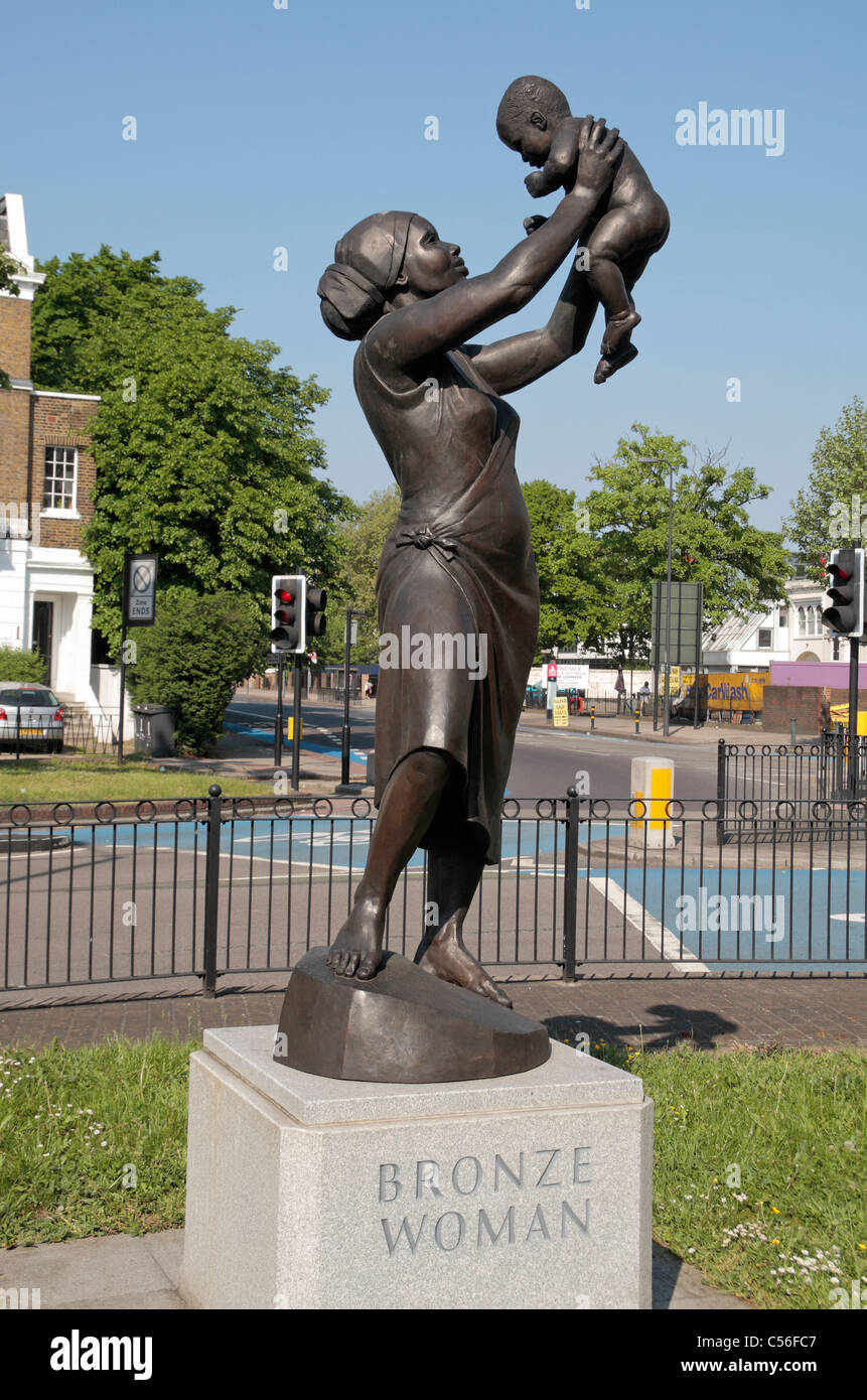 'Bronze Woman' sculpture by Aleix Barbat, in honour of black women in Britain, Stockwell Memorial Garden, London, UK. Stock Photo