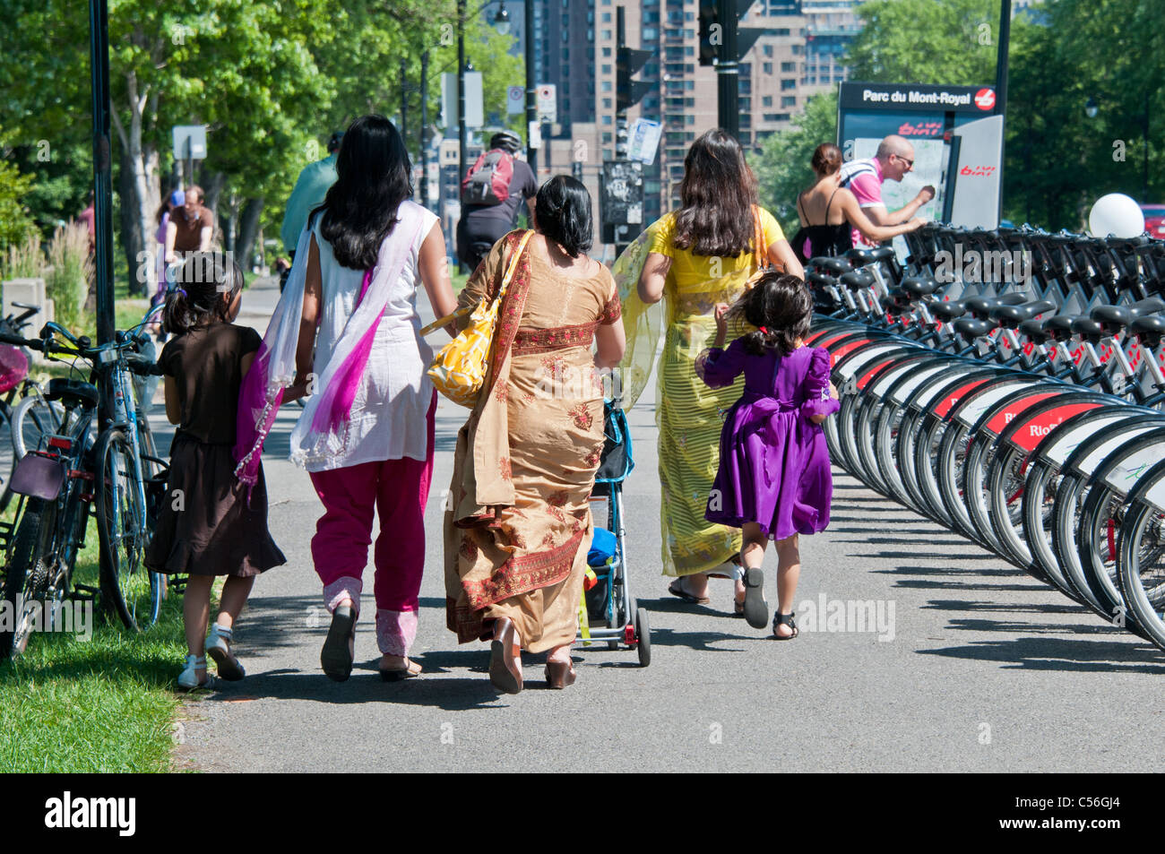 Ethnic people from Indian origin walking on Park avenue Montreal Canada Stock Photo
